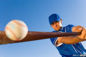 baseball-player-hitting-ball-with-bat-with-blue-sky-background